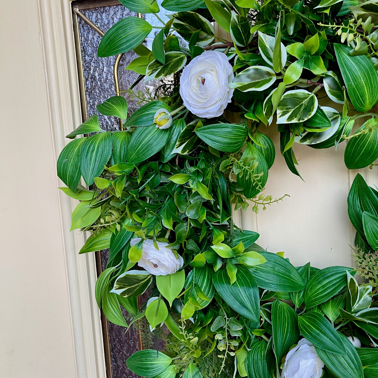 Handcrafted lush greenery front door wreath with white roses. Elegant farmhouse decor perfect for spring, summer, and year-round display.