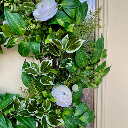 Handcrafted lush greenery front door wreath with white roses. Elegant farmhouse decor perfect for spring, summer, and year-round display.