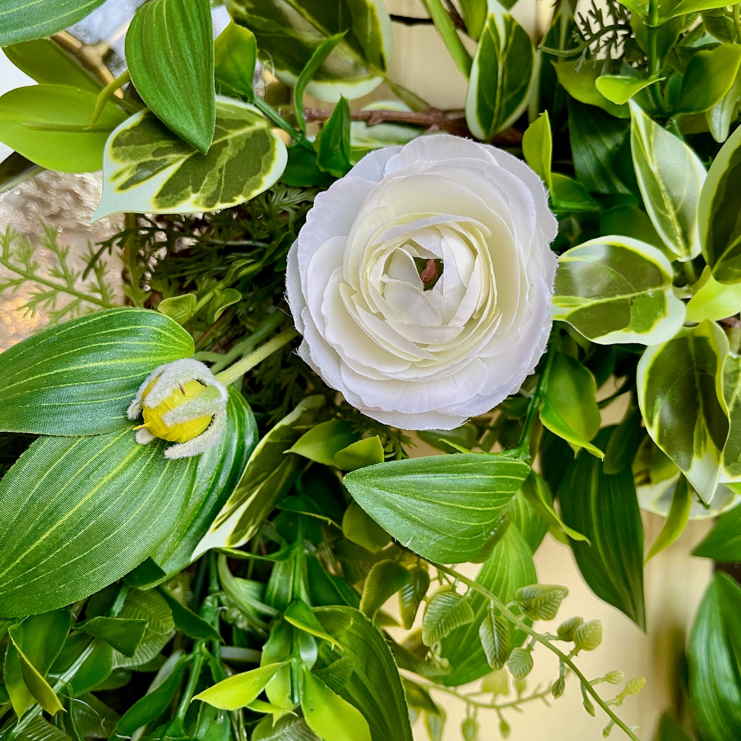 Handcrafted lush greenery front door wreath with white roses. Elegant farmhouse decor perfect for spring, summer, and year-round display.