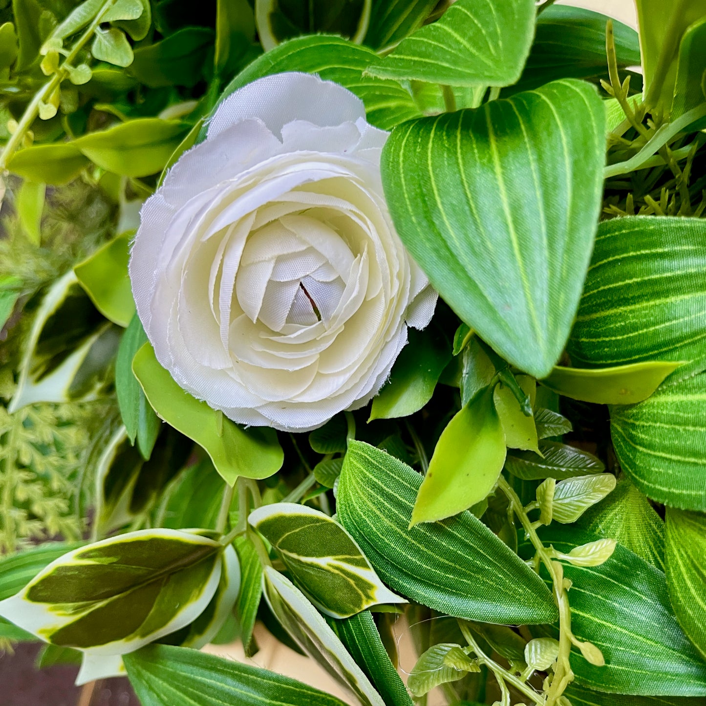 Handcrafted lush greenery front door wreath with white roses. Elegant farmhouse decor perfect for spring, summer, and year-round display.
