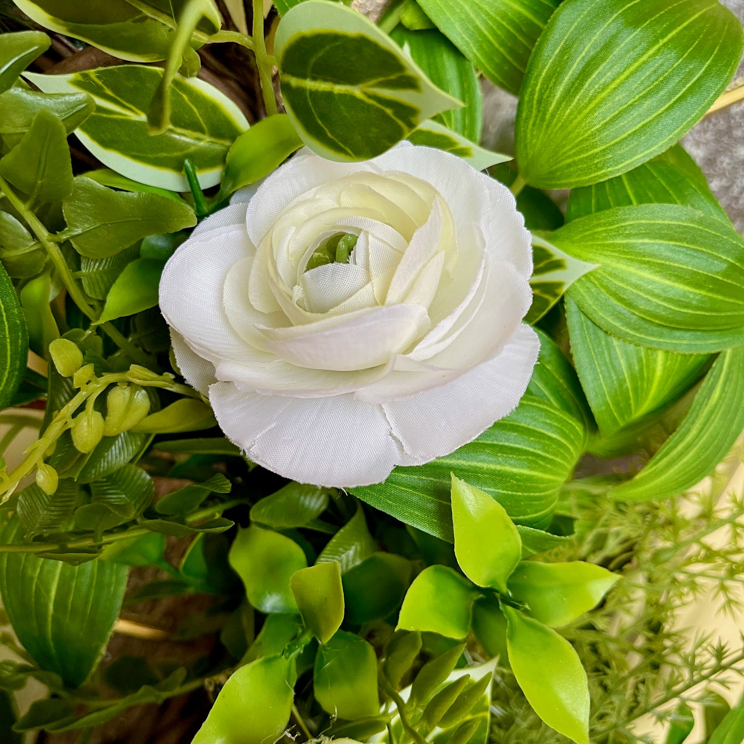 Handcrafted lush greenery front door wreath with white roses. Elegant farmhouse decor perfect for spring, summer, and year-round display.