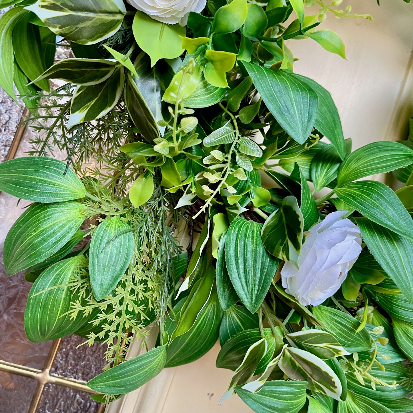 Handcrafted lush greenery front door wreath with white roses. Elegant farmhouse decor perfect for spring, summer, and year-round display.