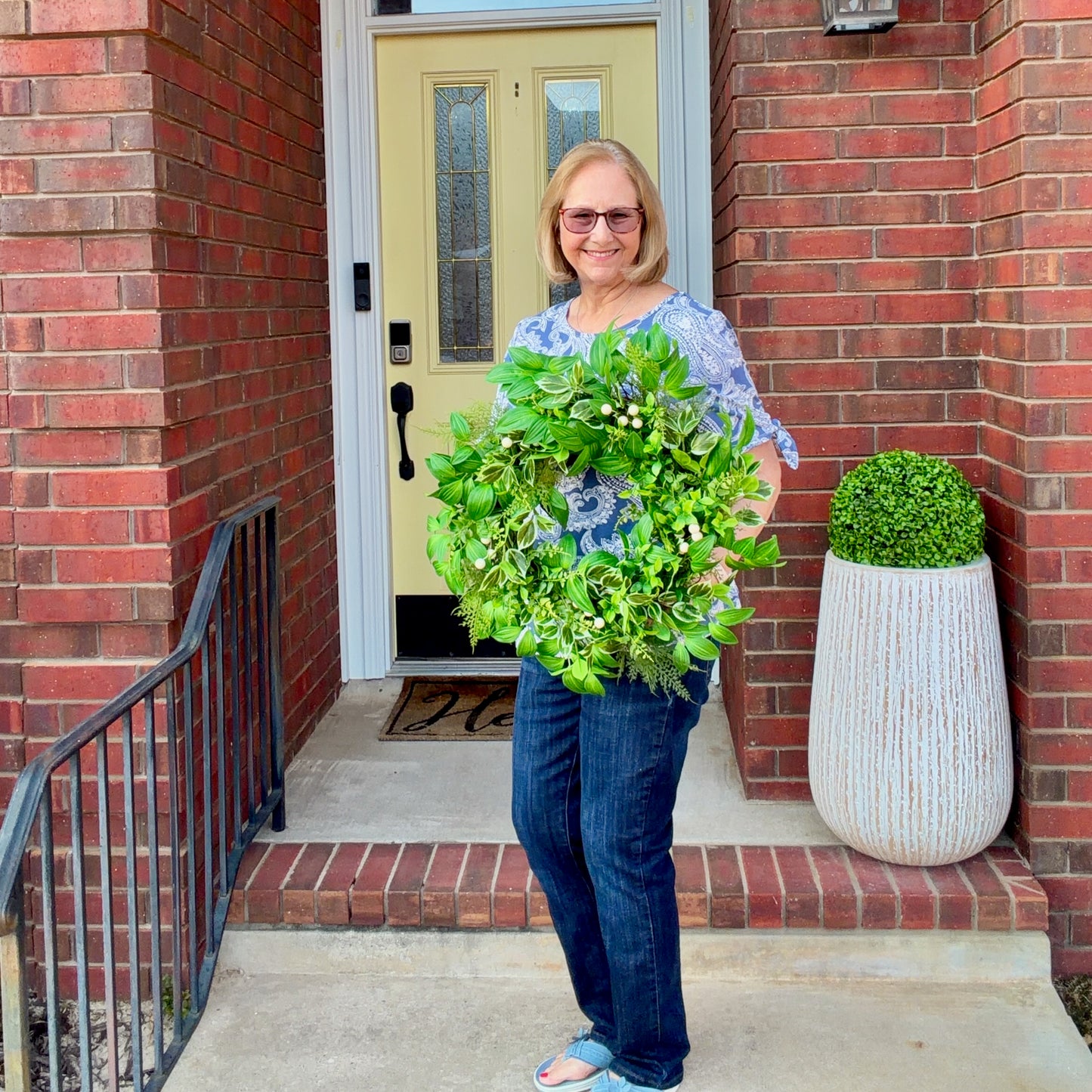 Handcrafted lush greenery front door wreath with white roses. Elegant farmhouse decor perfect for spring, summer, and year-round display.