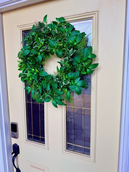 Handcrafted lush greenery front door wreath with white roses. Elegant farmhouse decor perfect for spring, summer, and year-round display.