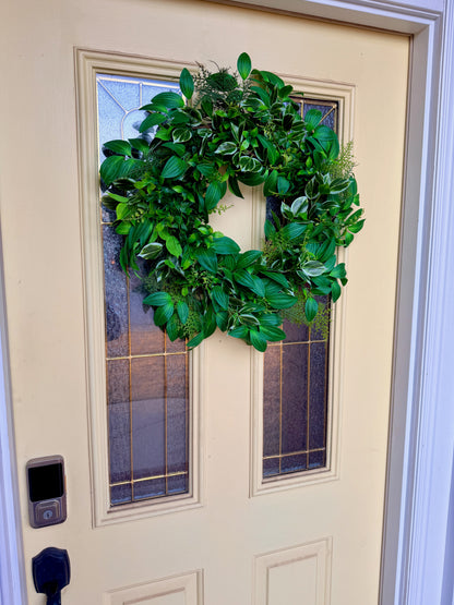 Handcrafted lush greenery front door wreath with white roses. Elegant farmhouse decor perfect for spring, summer, and year-round display.