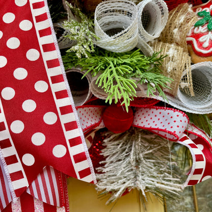 Close-up of decorative ribbons with red, white, and green colors on a neutral background.